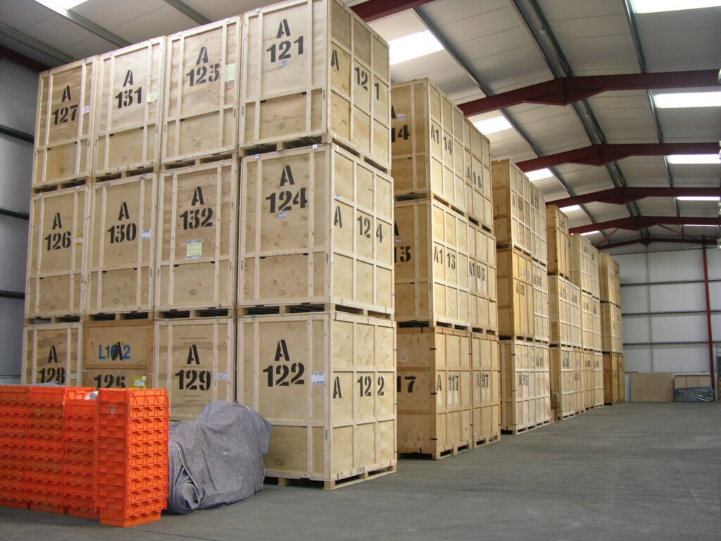 Numbered timber storage containers stacked in a storage warehouse
